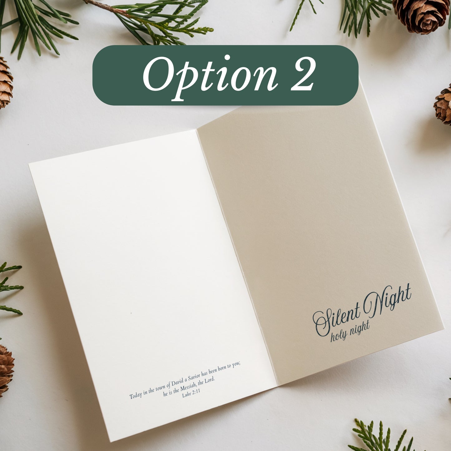 Open card with 'Silent Night holy night' text on a white background with Christmas decorations.