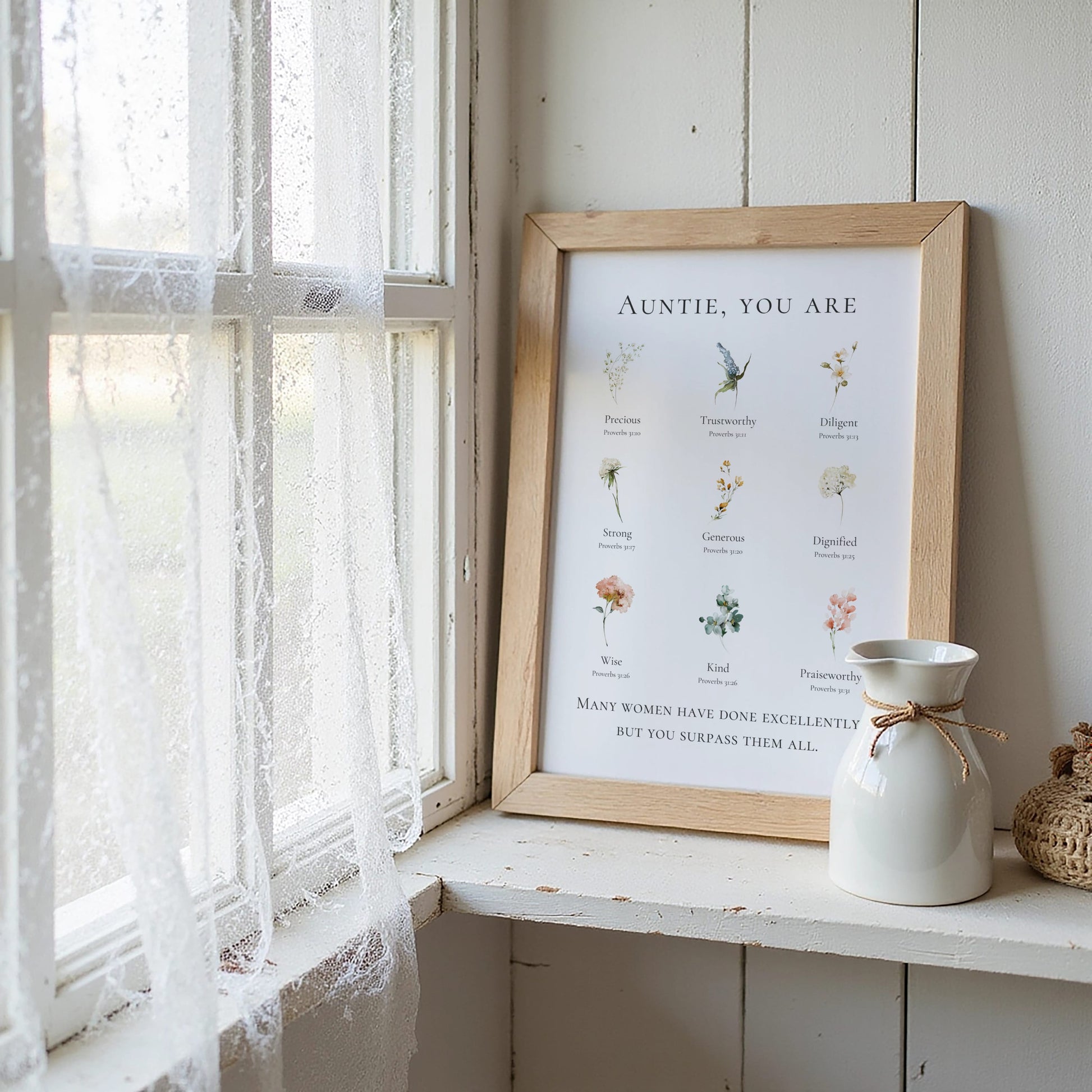 Framed print titled "Auntie, You Are' on a windowsill with a vase and decorative item.