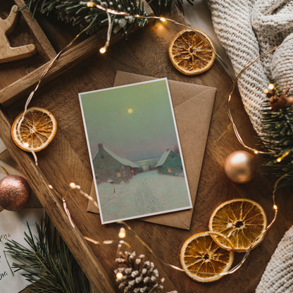 Christmas card with envelope on a wooden surface with decorative elements