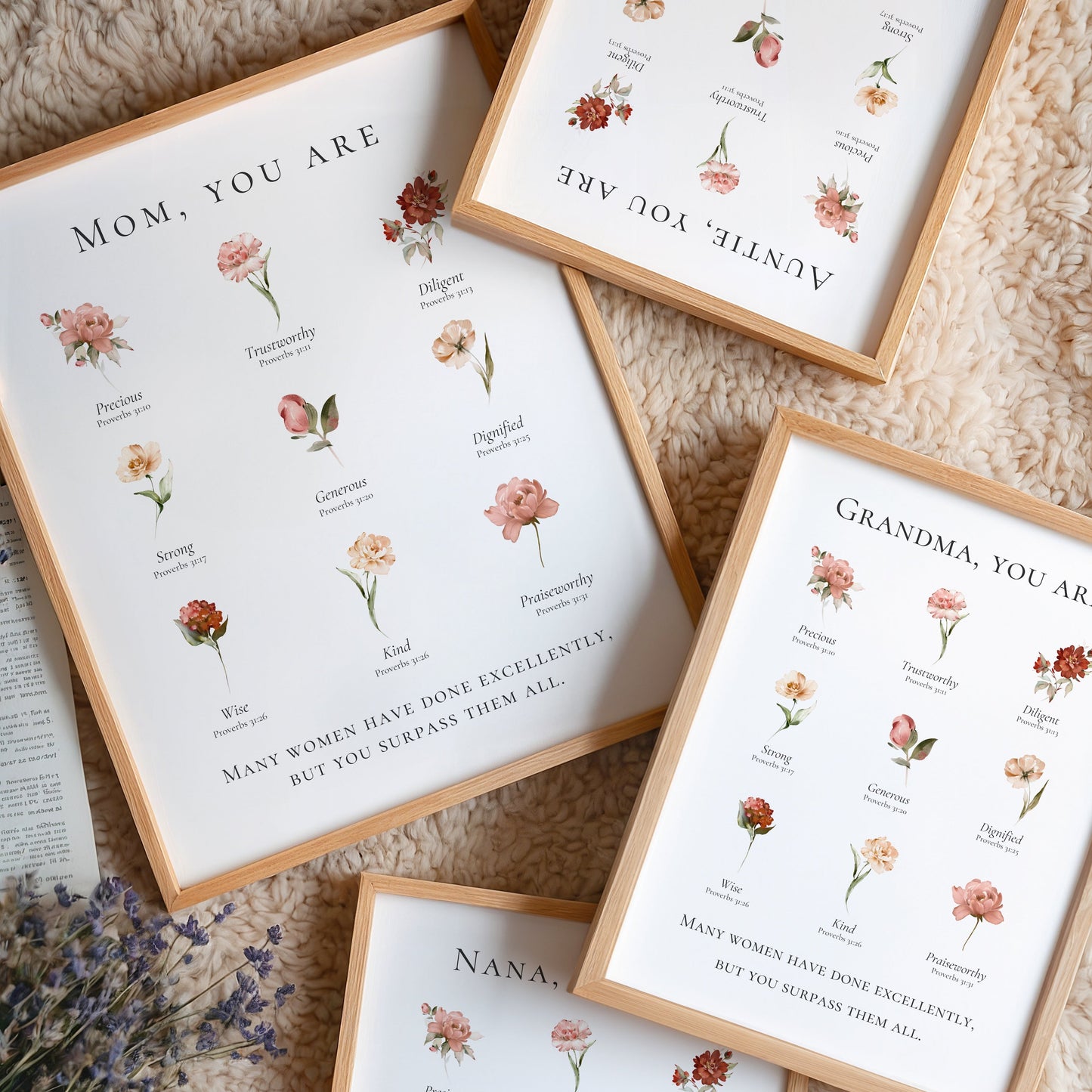 Four framed prints with floral designs and text on a textured surface.