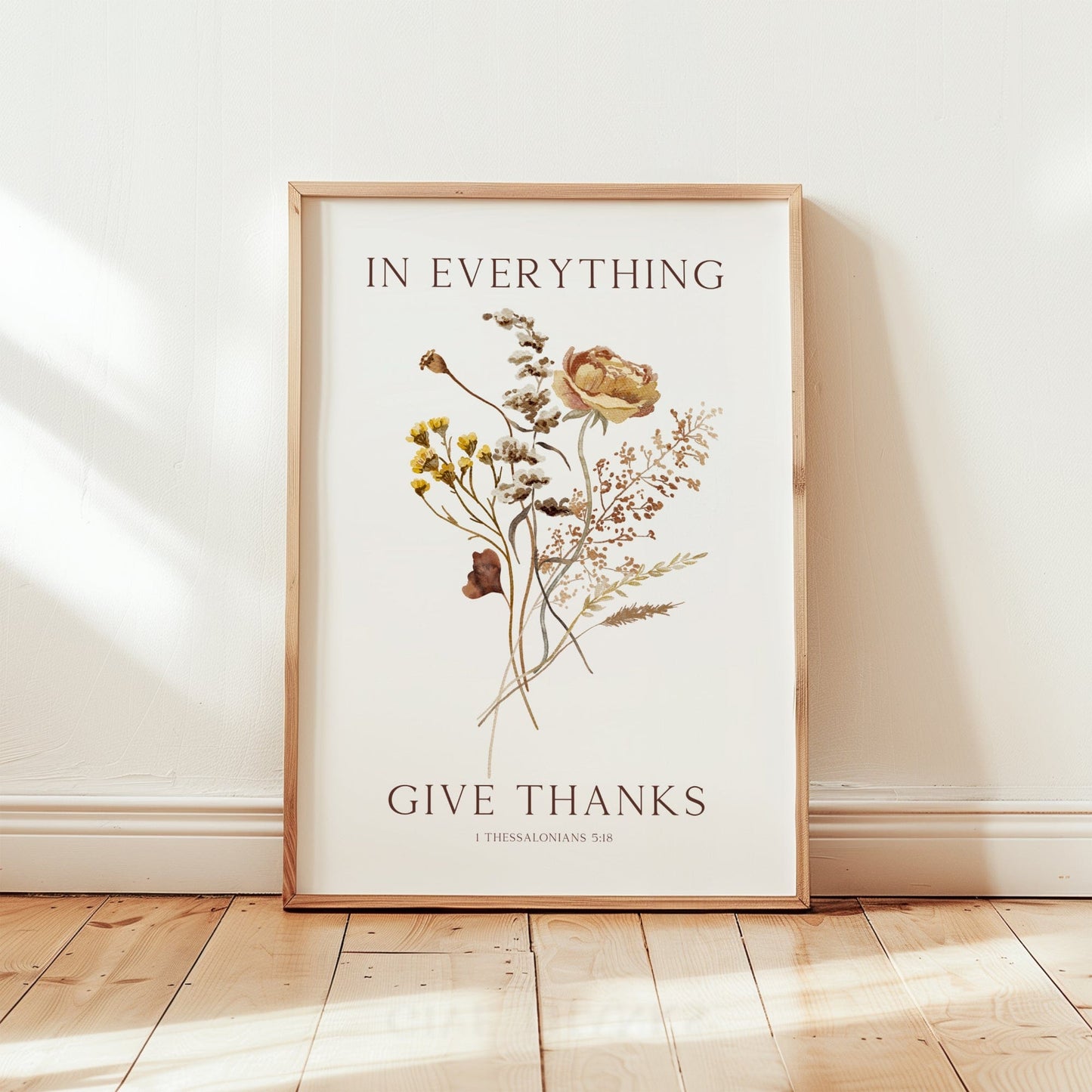Framed artwork with floral design and 'Give Thanks' text on a white background