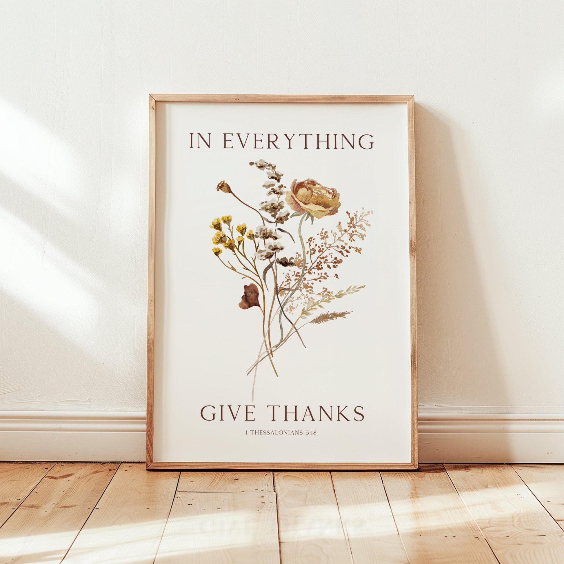 Framed artwork with floral design and 'Give Thanks' text on a white background