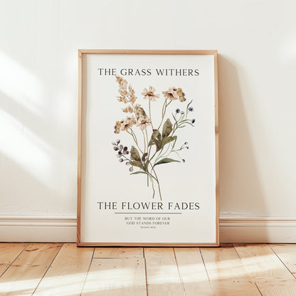 Framed botanical print with floral design and text on a white wall.