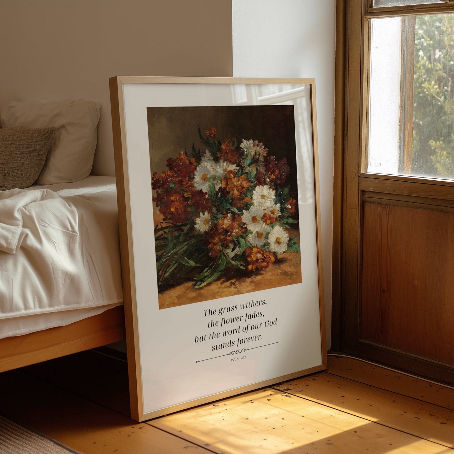 Framed artwork of flowers on a wall next to a bed