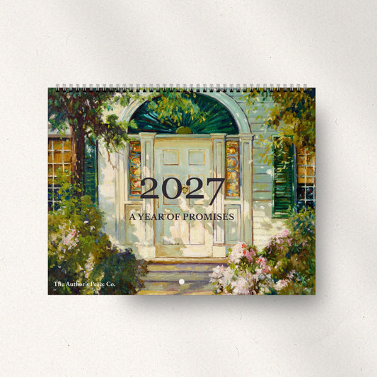 A spiral-bound 2027 wall calendar titled 'A Year of Promises' by The Author's Press Co., featuring an impressionistic painting of a white front door framed by green foliage and pink flowers, shown against a textured off-white wall.