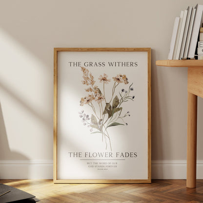 Framed botanical print on a wall next to a wooden table with books