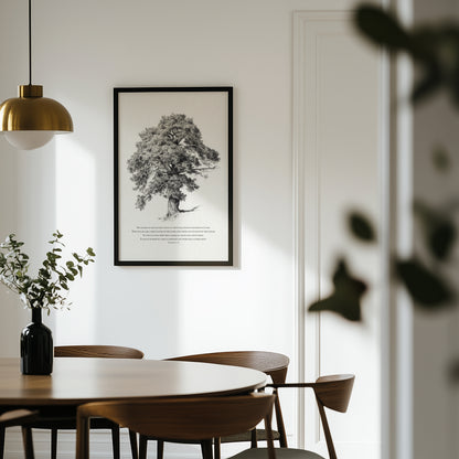 Dining room with wooden table and chairs, framed black and white tree print on the wall.