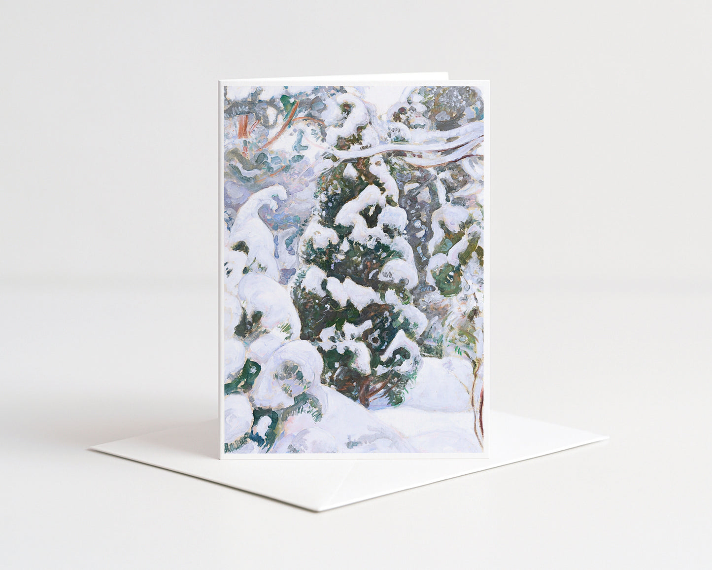 Greeting card with a snowy forest design on a white background