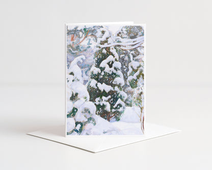 Greeting card with a snowy forest design on a white background