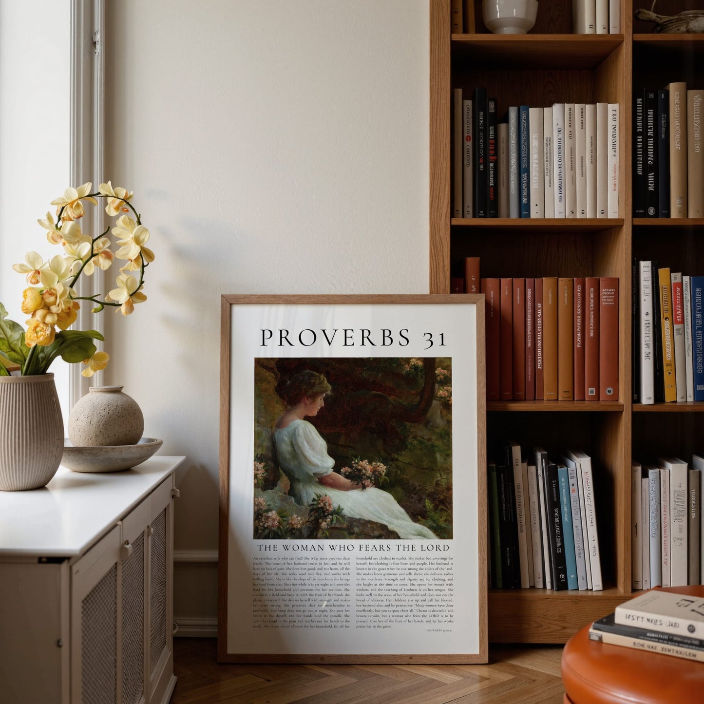 Framed poster with 'Proverbs 31' text and illustration in a home setting with books and decor.