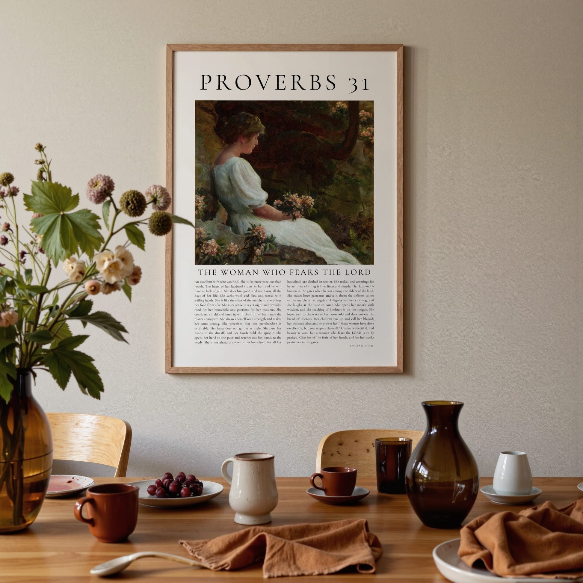 Framed artwork titled 'Proverbs 31' on a wall above a dining table with decor items.