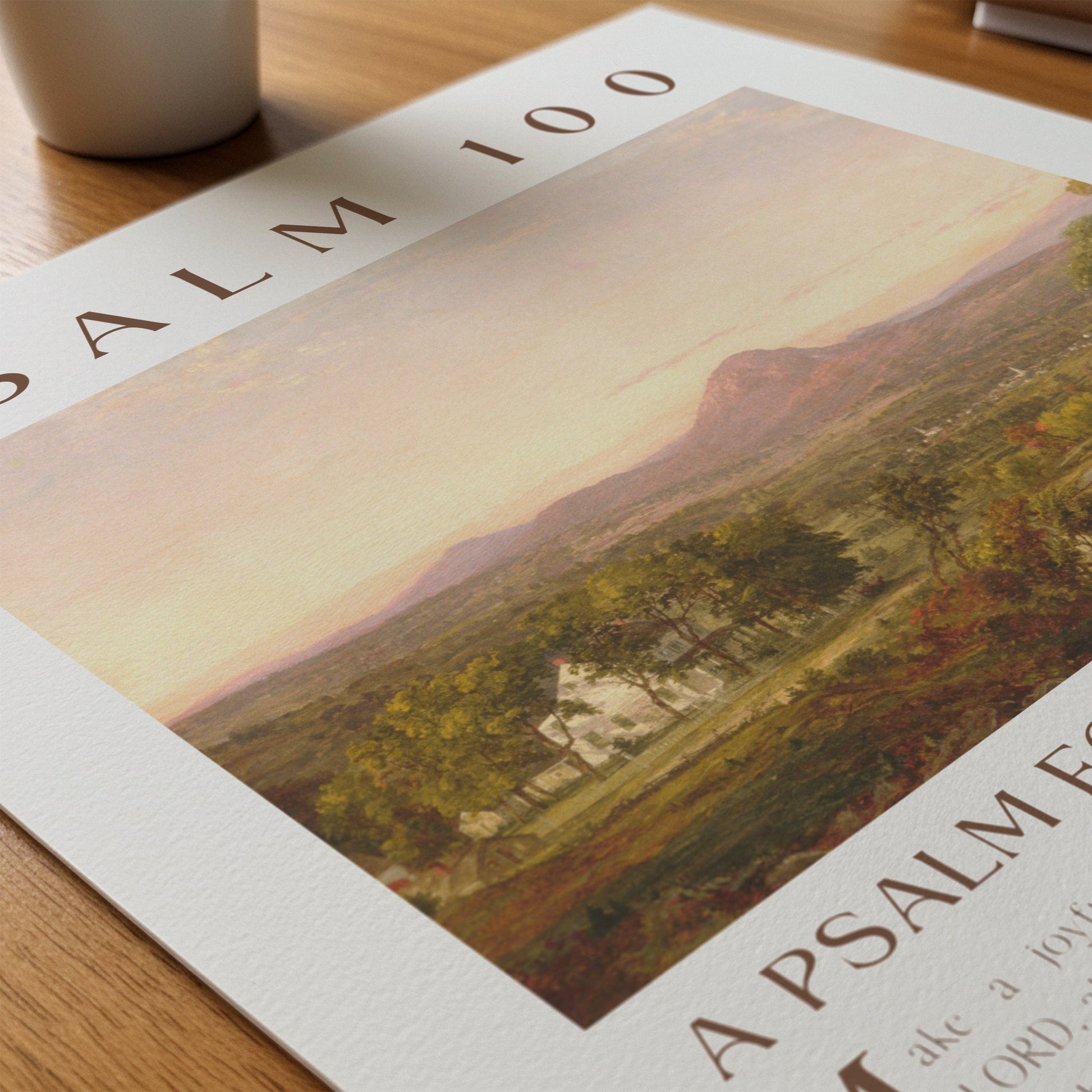 Art Poster with a scenic landscape on a wooden surface