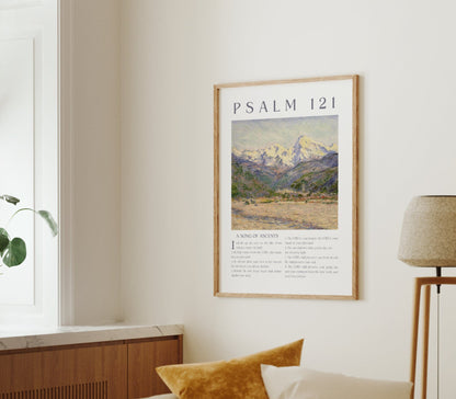 Living room with a framed poster of Psalm 121, a plant on a windowsill, and a lamp.