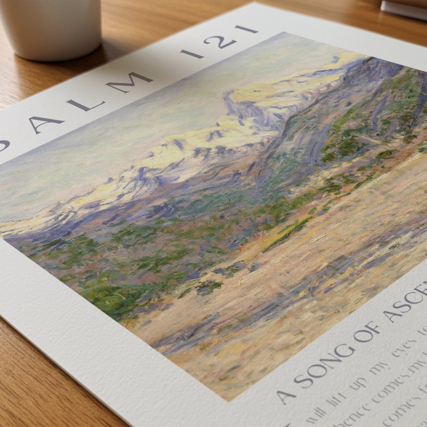 Art print of a landscape with text on a wooden surface