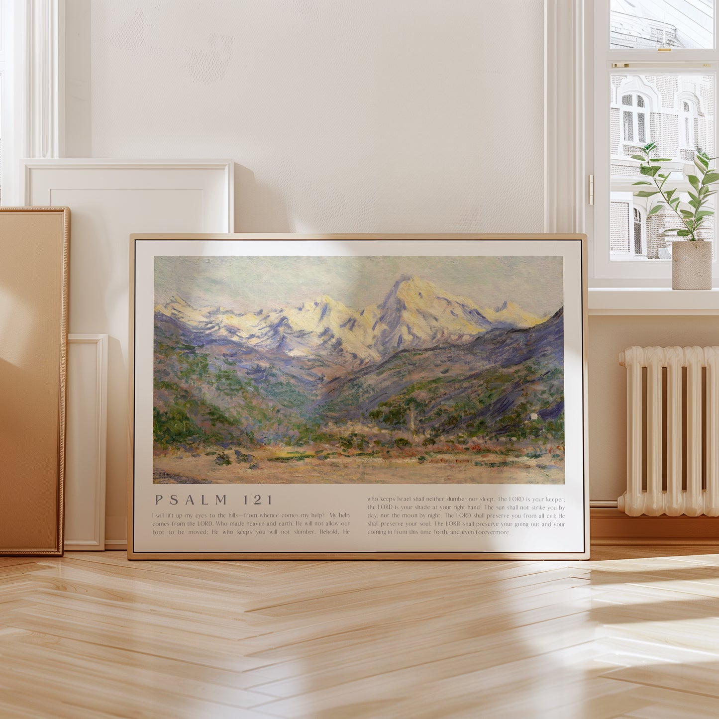 Framed artwork with mountain landscape and 'Psalm 121' text in a room with a radiator and window.