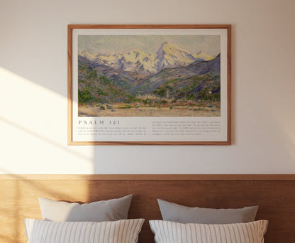 Bedroom with wooden headboard, striped bedding, and framed mountain landscape artwork.