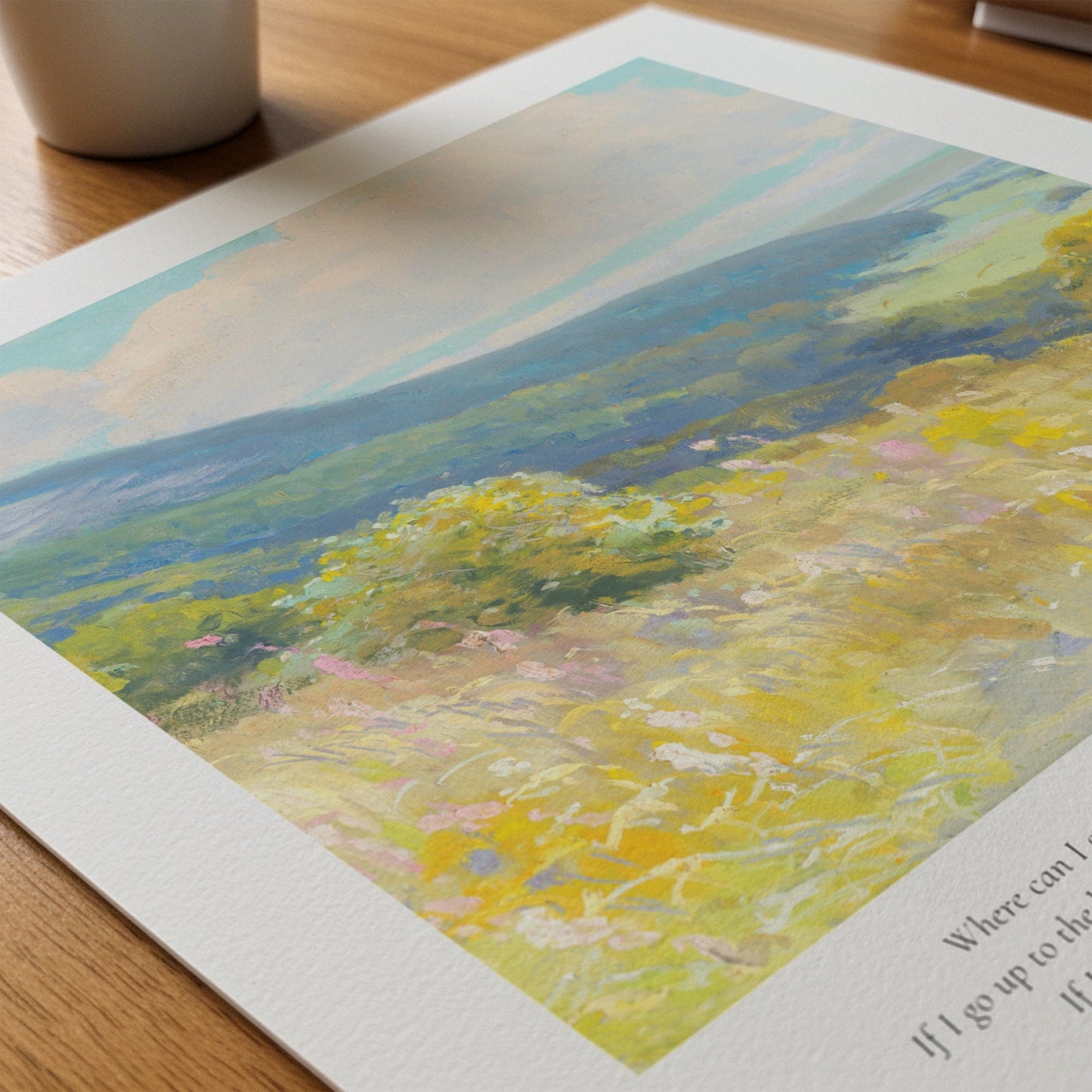 Artistic depiction of a landscape with mountains and fields on a wooden surface