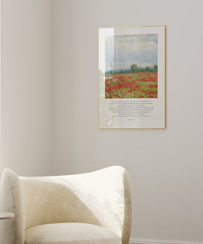 Modern living room with a white armchair, side table, and framed artwork on the wall.