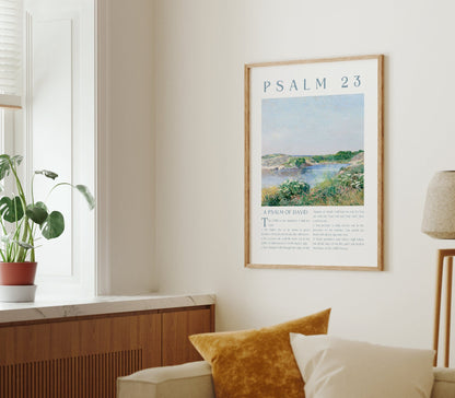Living room with a framed poster of Psalm 23, a plant on a windowsill, and a lamp.