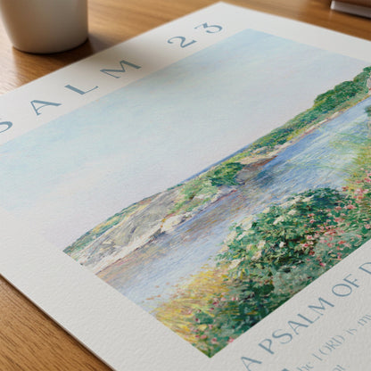 Artistic depiction of a landscape with a river and greenery on a printed page.