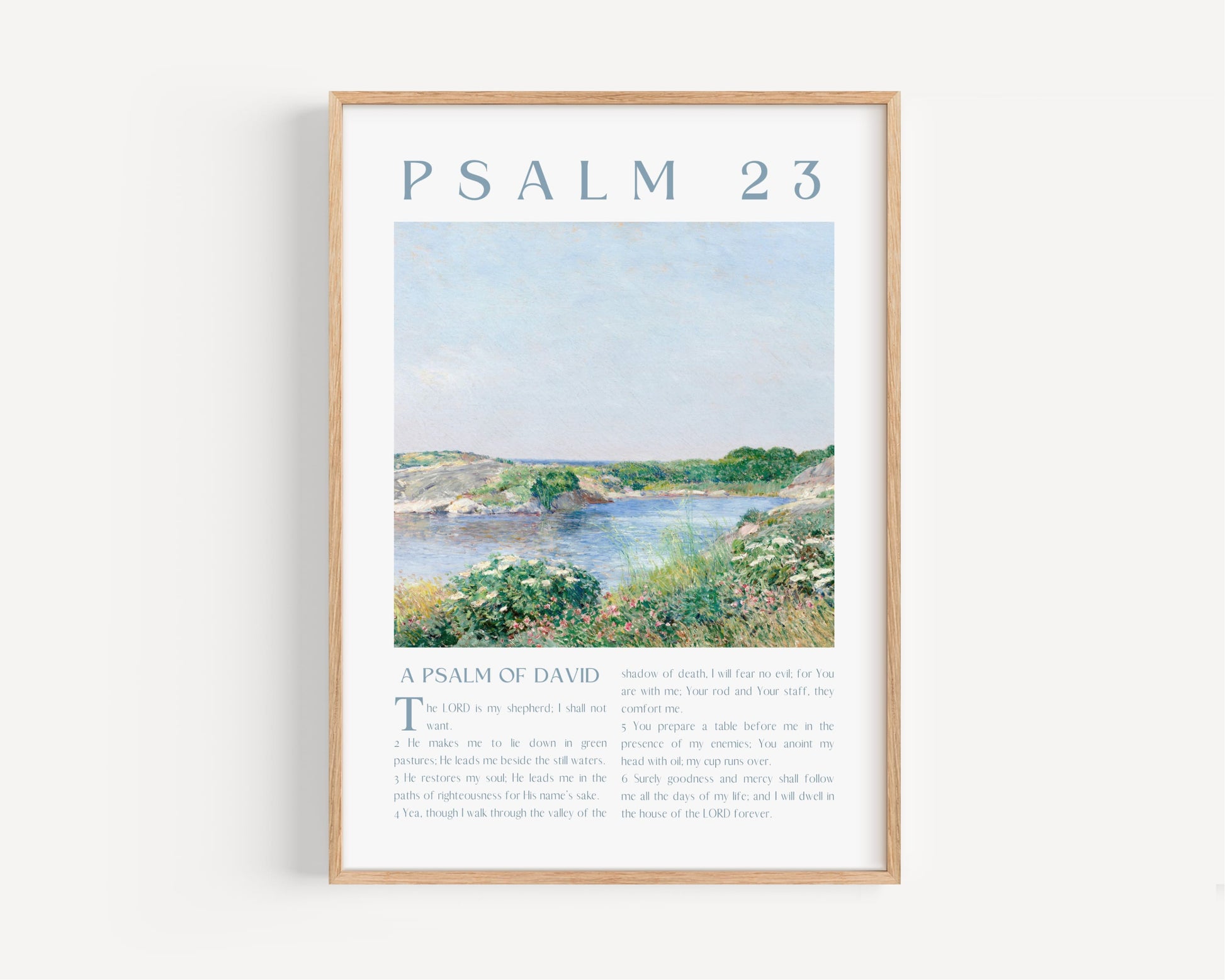 Framed artwork with a landscape scene and 'Psalm 23' text on a white background