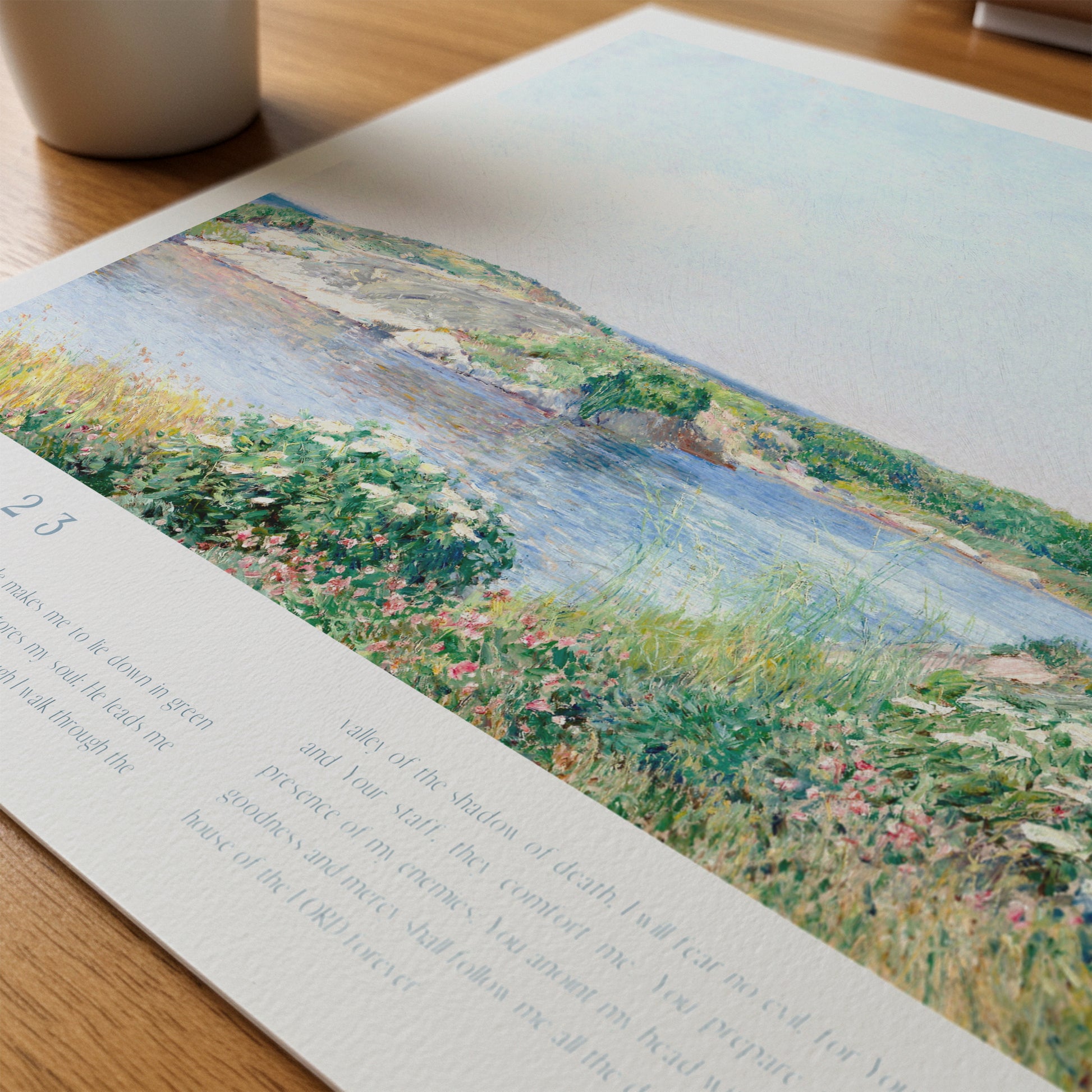 Artistic depiction of a landscape with water and greenery on a printed page.