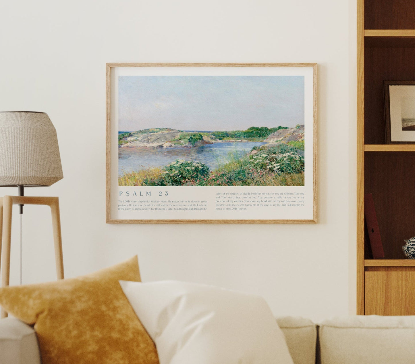 Living room with beige sofa, framed artwork, and wooden shelves.
