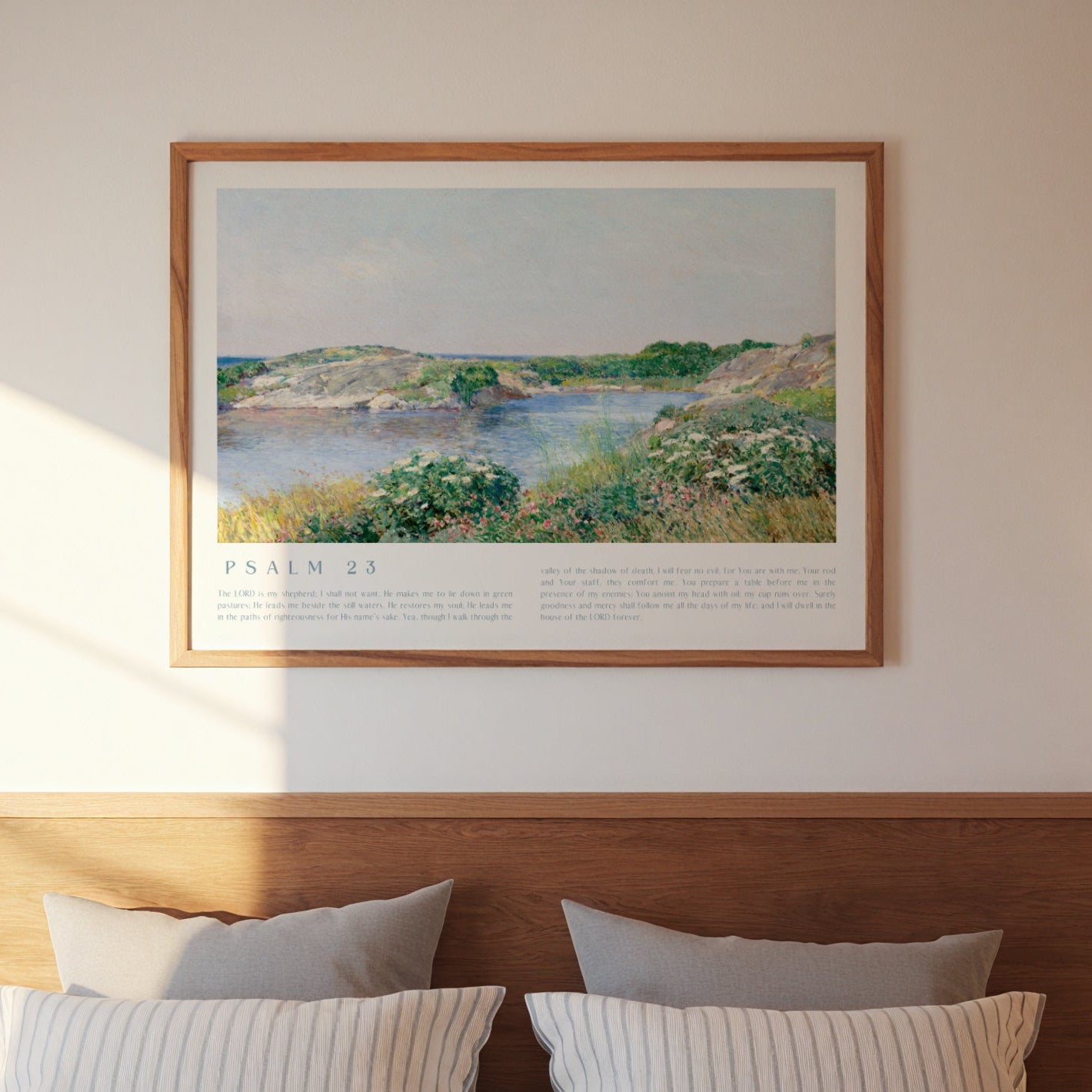 Bedroom with wooden headboard, striped bedding, and framed landscape print on wall.