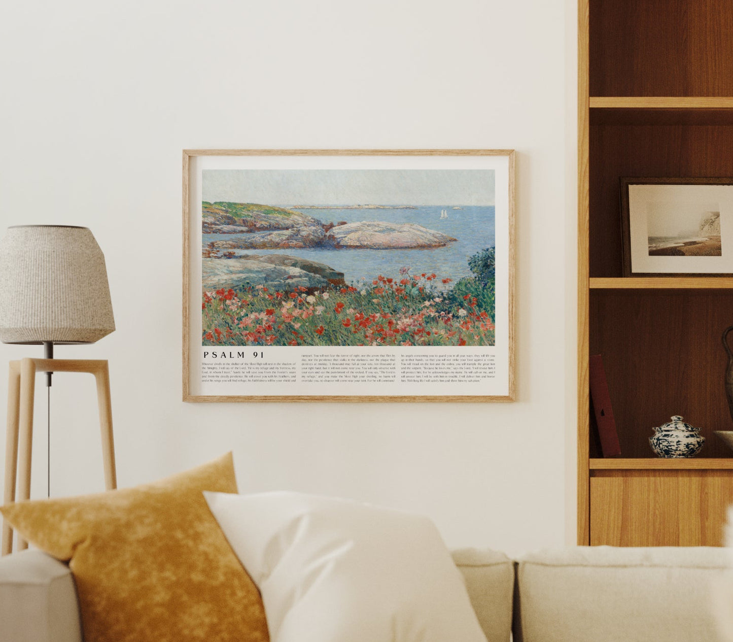 Living room with beige sofa, decorative pillows, and a framed picture on the wall.