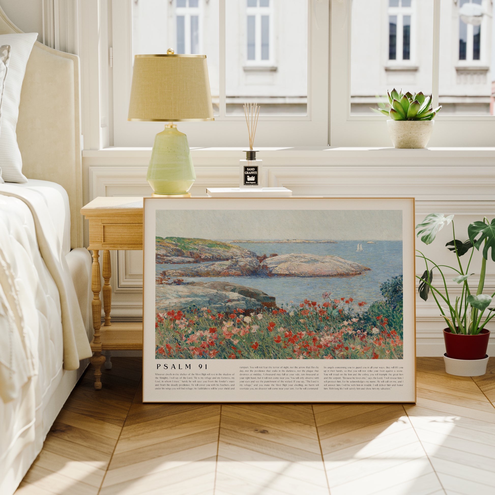 Framed artwork of a coastal scene with flowers in a bedroom setting