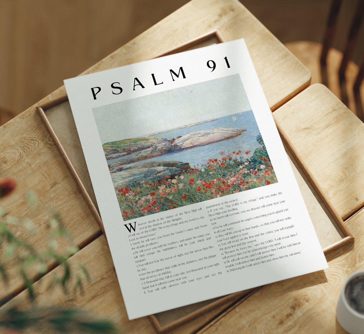 Art Print  'Psalm 91' on a wooden table with a cup of coffee and plant.