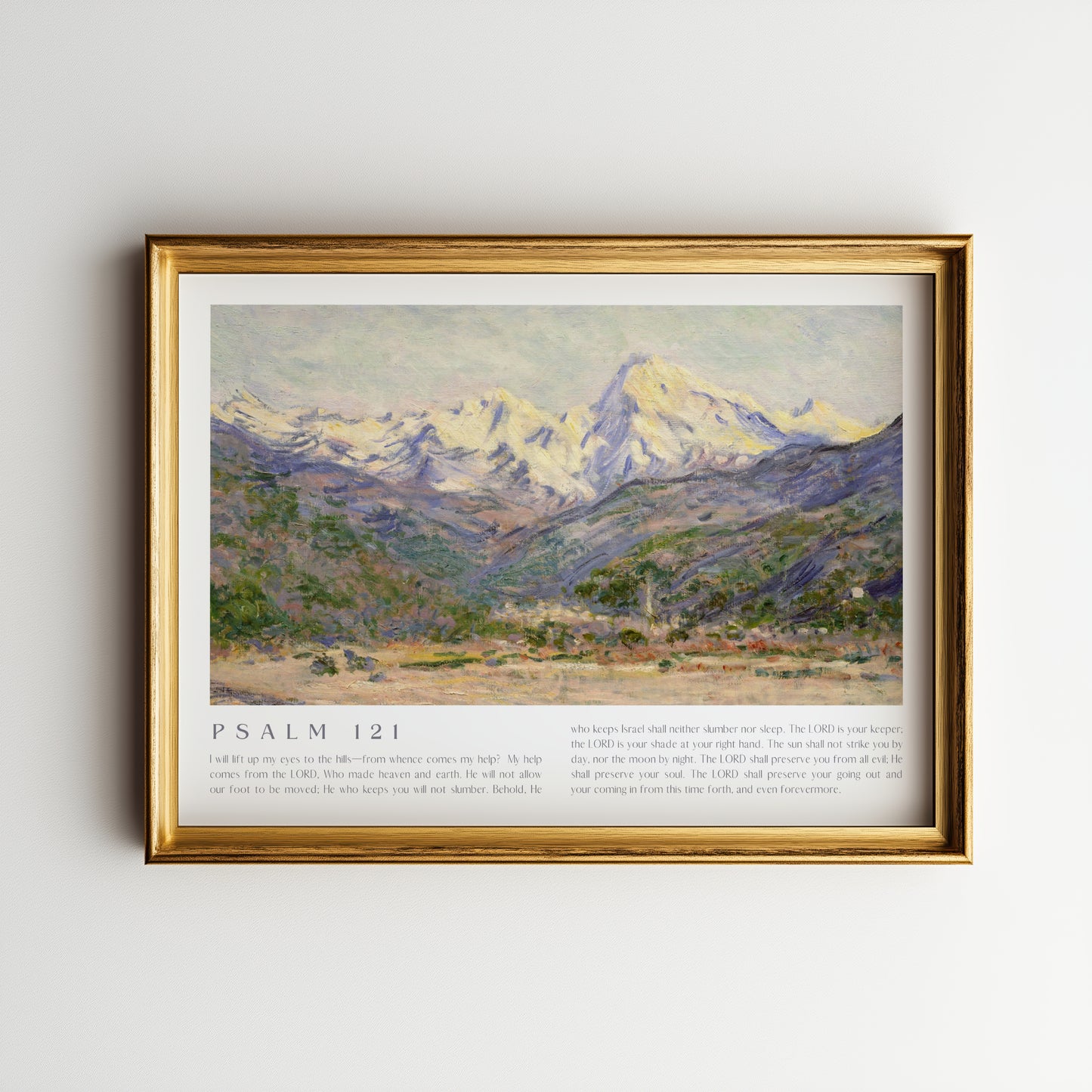 Framed artwork of a mountain landscape with 'Psalm 121' text on a plain wall.