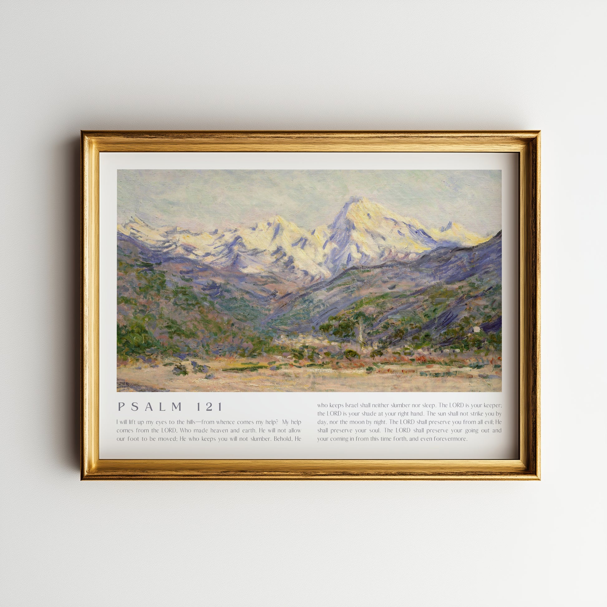 Framed artwork of a mountain landscape with 'Psalm 121' text on a plain wall.