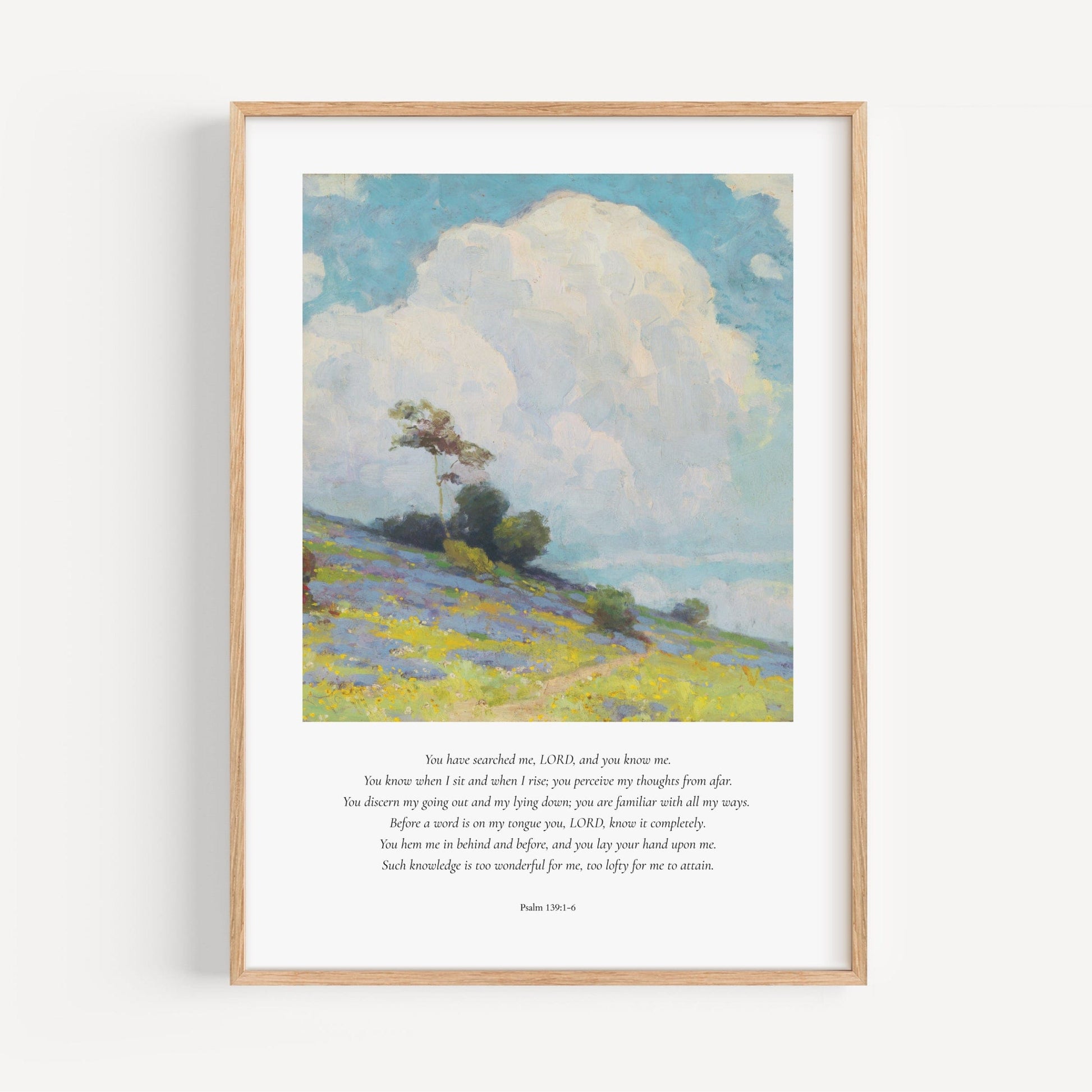 Framed artwork of a landscape with a tree and open field, featuring text on a white background.