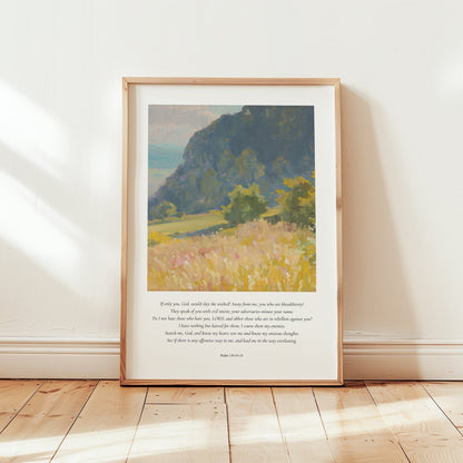 Framed artwork of a landscape with text on a white wall.
