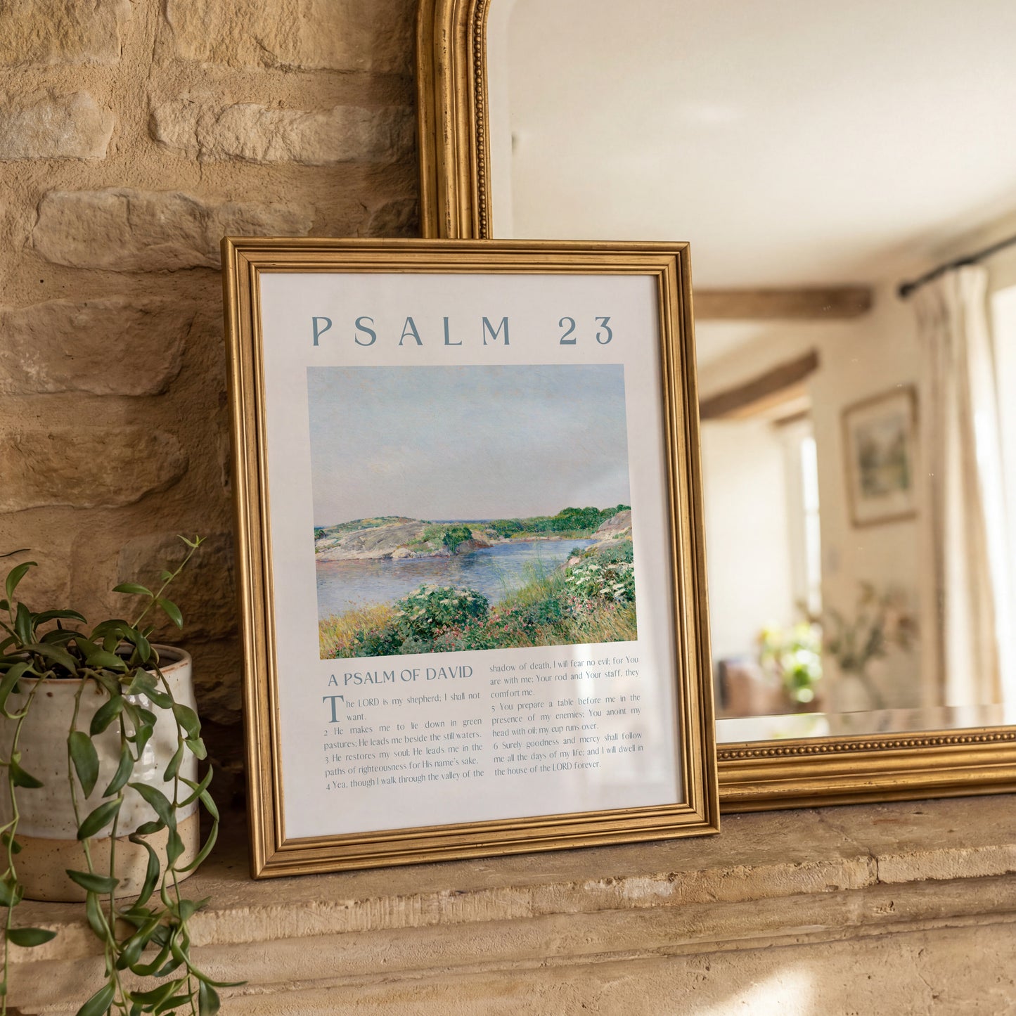 Framed artwork with 'Psalm 23' text and landscape illustration on a stone wall.
