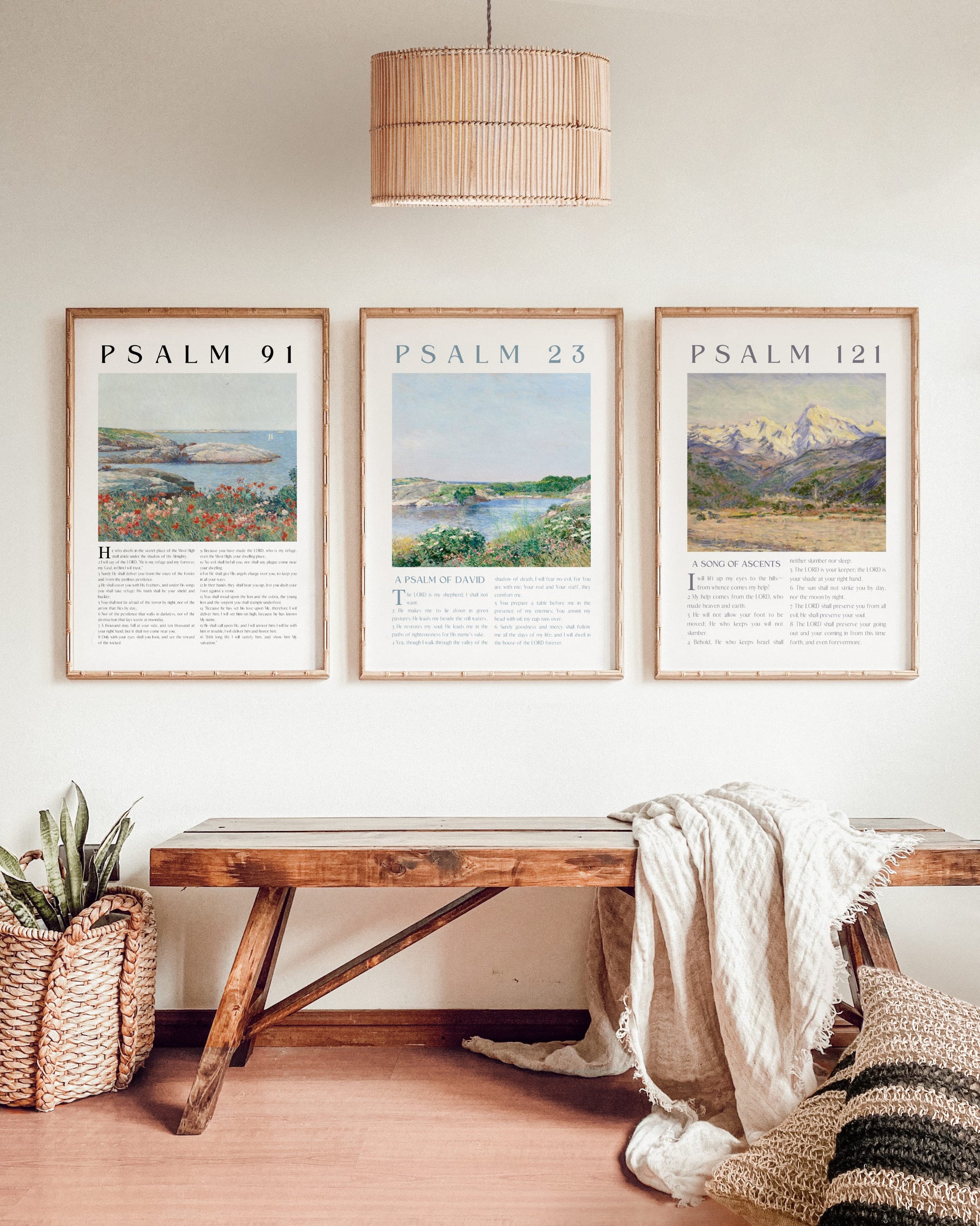 Three framed prints titled 'Psalm 91', 'Psalm 23', and 'Psalm 121' above a wooden bench in a room.