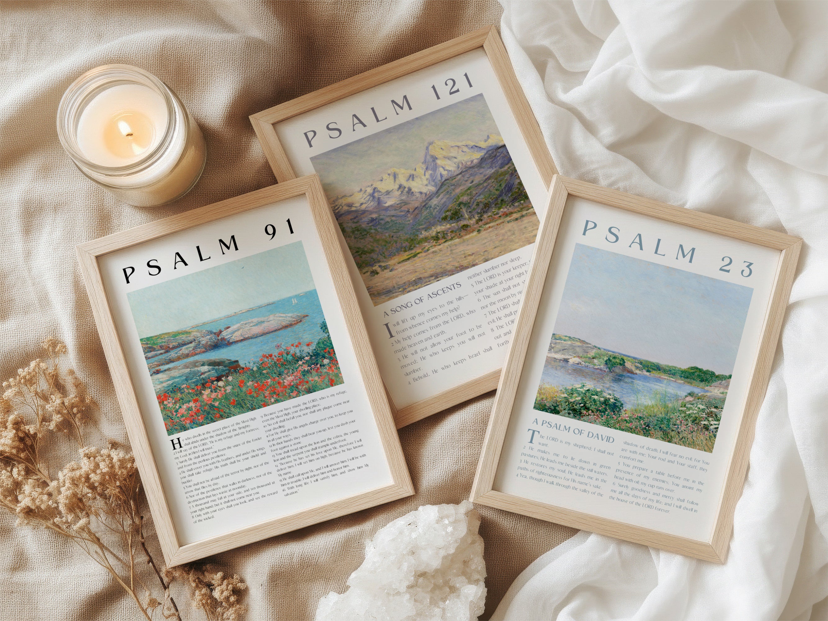 Three framed prints titled 'Psalm 91', 'Psalm 23', and 'Psalm 121' arranged on fabric