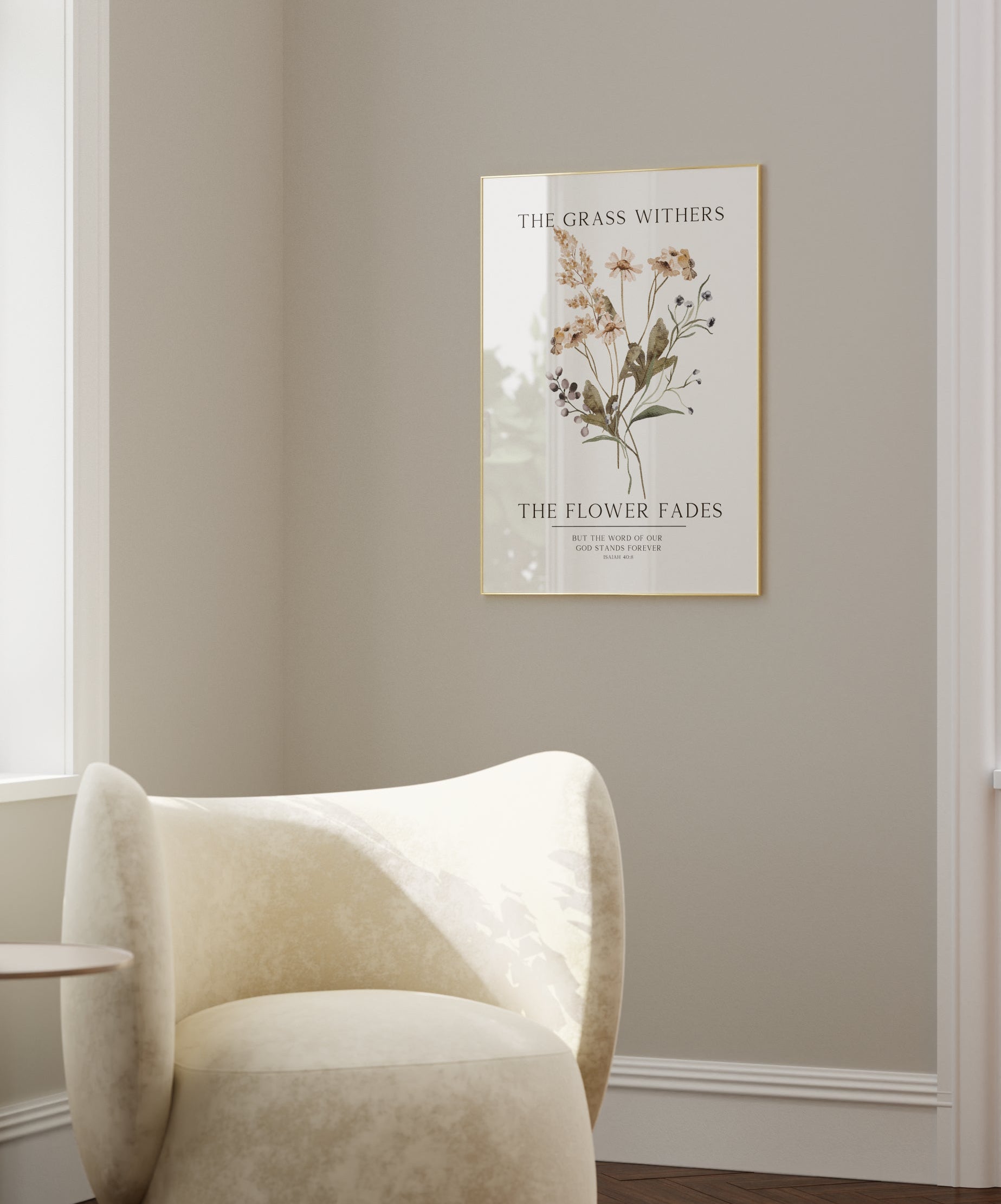 White armchair in a room with a floral poster on the wall
