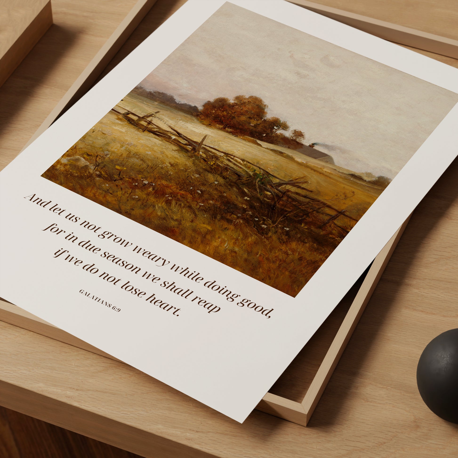 Landscape print with text on a wooden surface